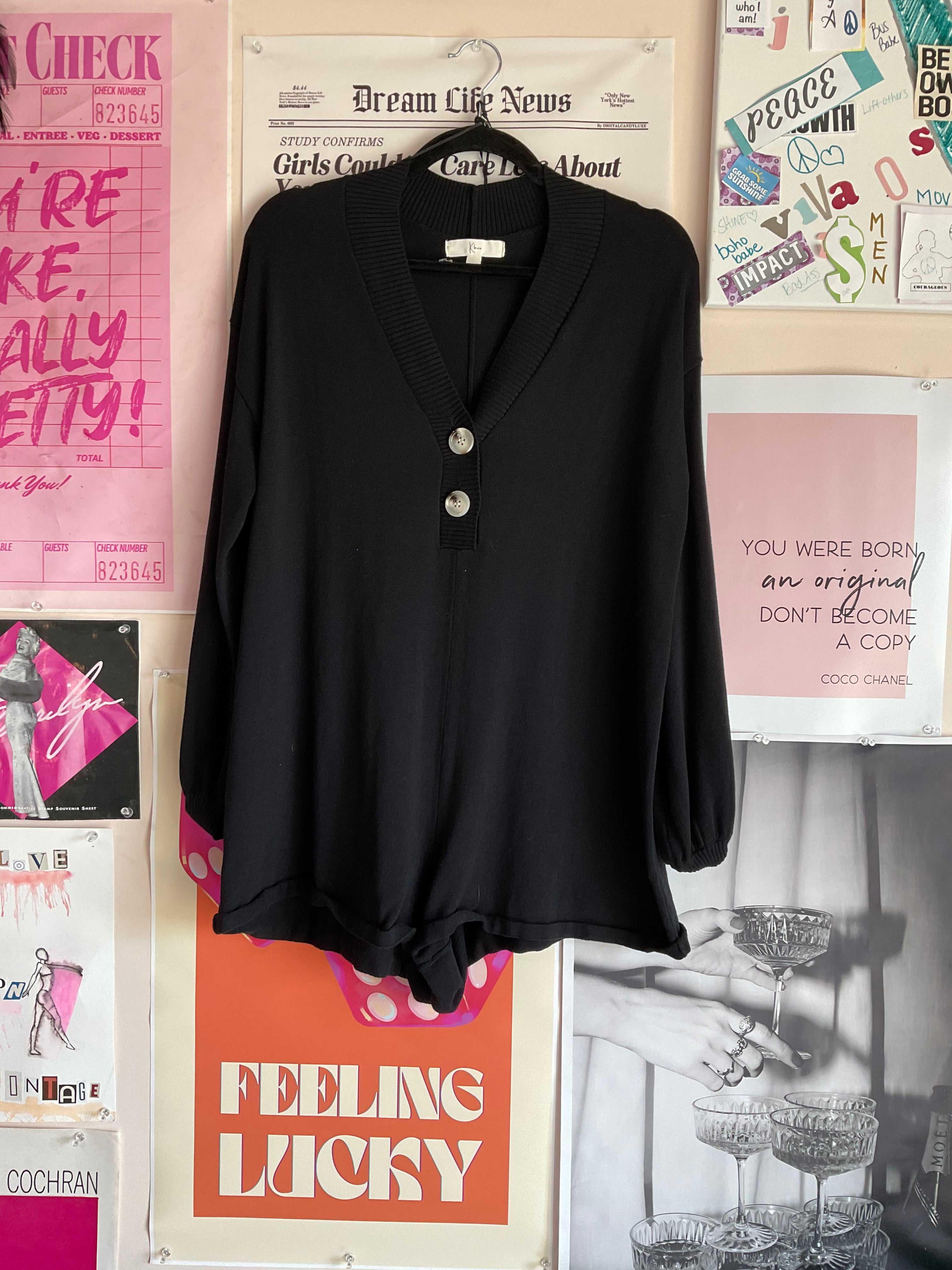 Black long sleeve button-front romper